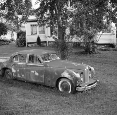 Rusted-Old-Car-In-The-Front-Yard